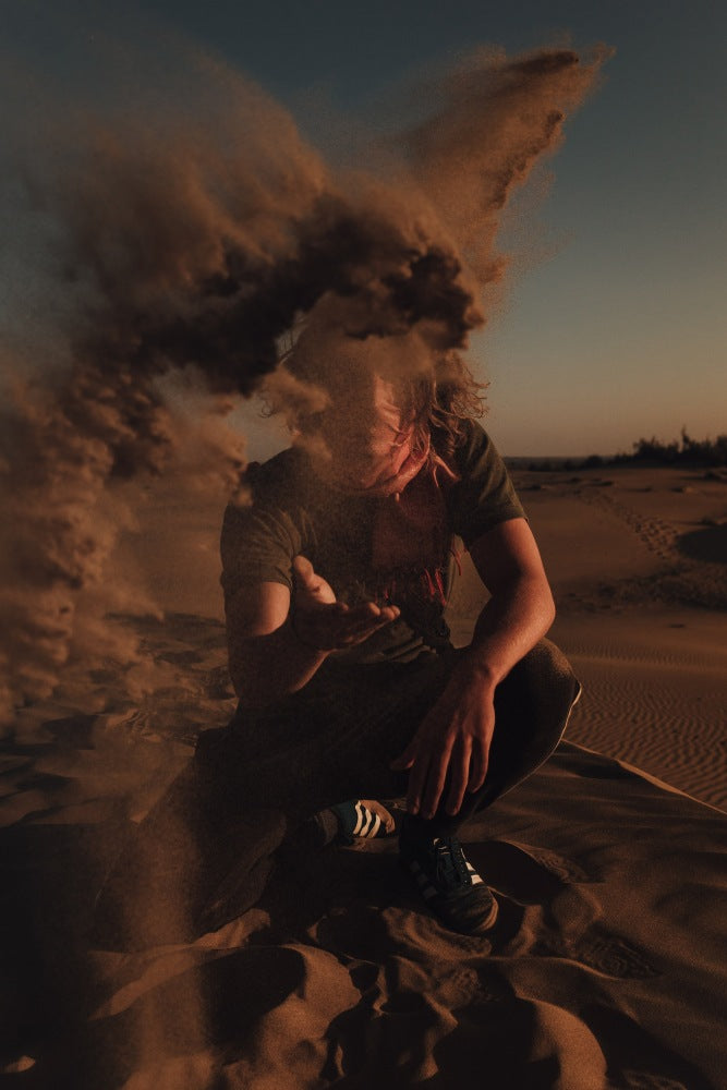 Happii Human Happy Human How to be happy man in desert blowing sand at camera